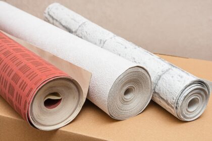 Three,Rolls,Of,Wallpaper,In,Various,Colors,And,Textures.,Home