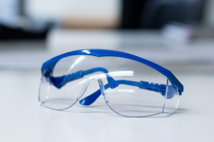 Close-up,Of,Blue,Safety,Goggles,On,A,Desk,In,A