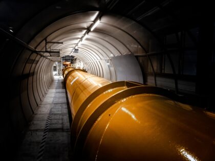 Illuminated,Gas,Or,Oil,,Orange,Pipeline,In,Dark,Tunnel.