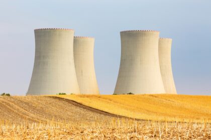 Nuclear,Power,Plant,With,Cooling,Towers,Producing,Electric,Current,In