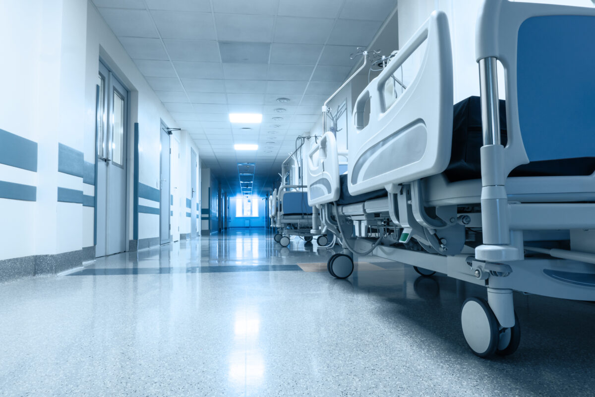 Long corridor in hospital with surgical transport.