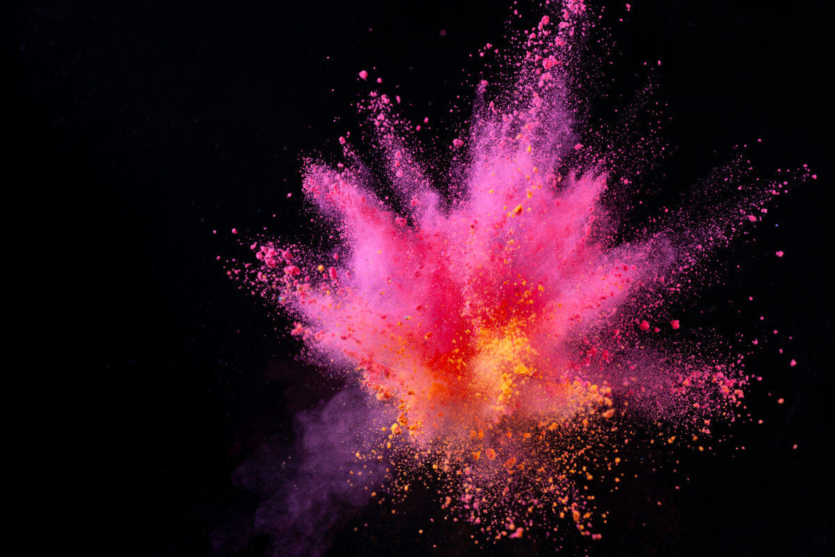 colorful powder explode on black background captured in high speed