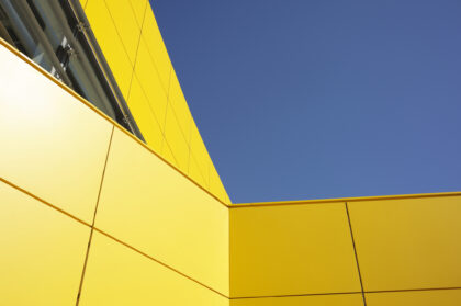 Modern Yellow Architecture Against Blue Sky