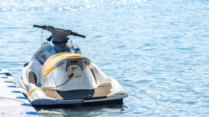 Jet ski moored a floating dock on serene waters