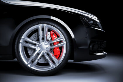 Sports,Car,Wheel,With,Red,Brakes,In,Studio,Lighting.,3d