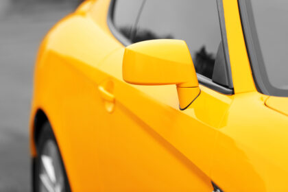 Side,Mirror,Of,Yellow,Car,,Closeup