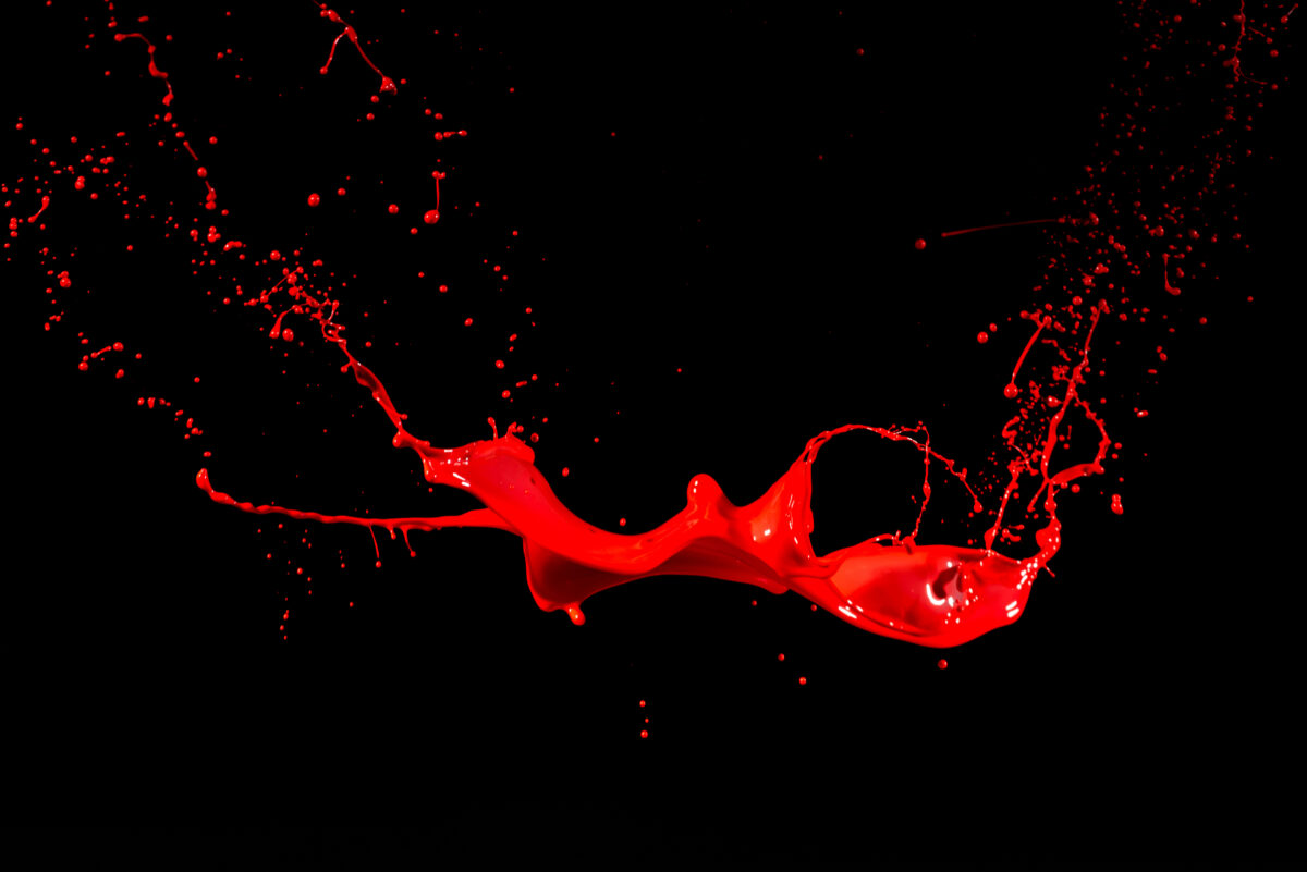isolated red paint against black backgrounds