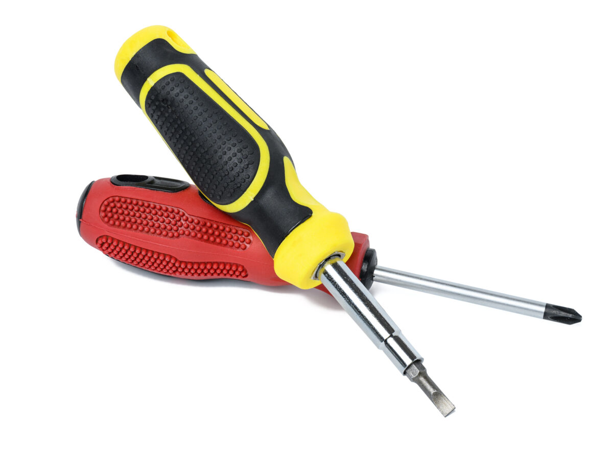 Screwdriver with a rubber handle on a white isolated background