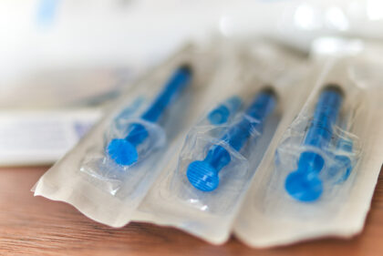 disposable syringes are lying on the table