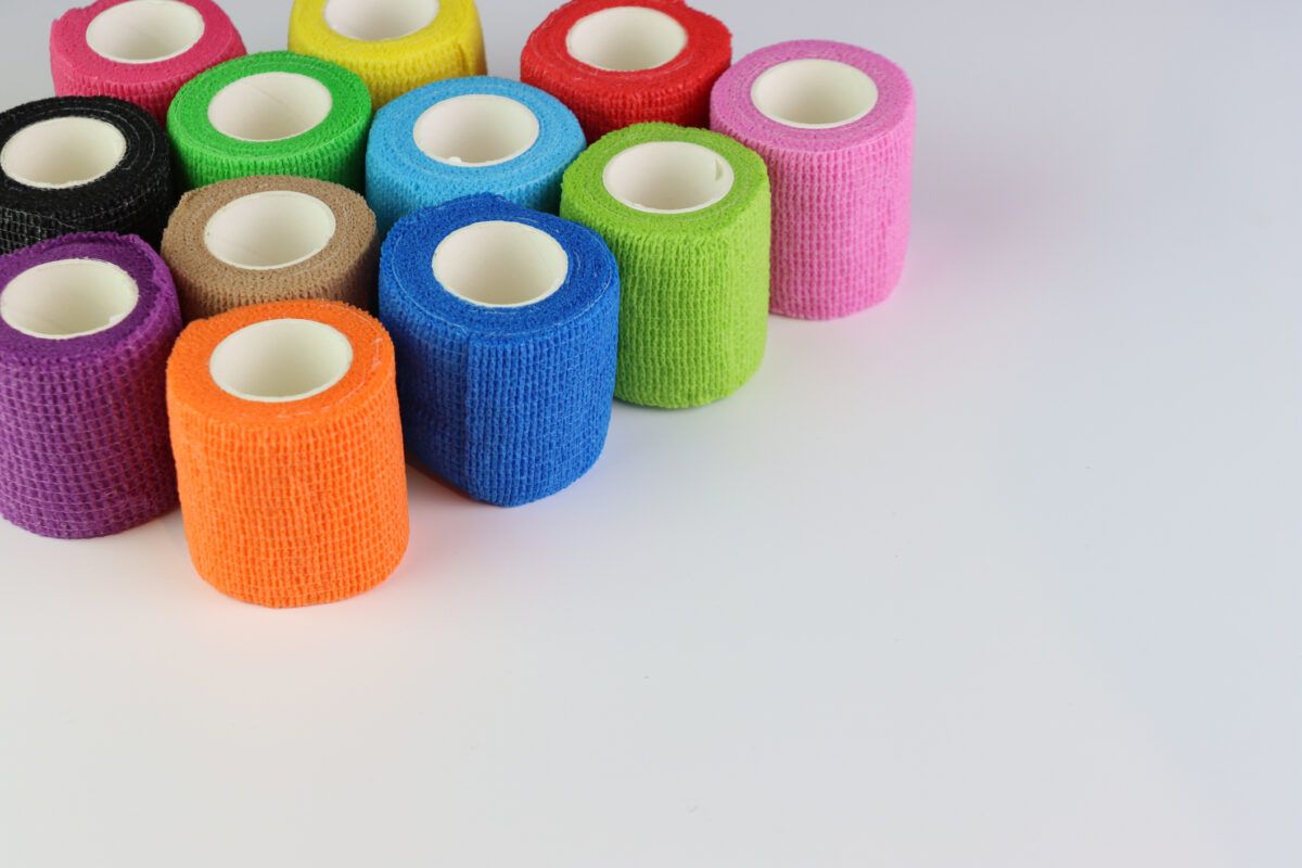 Different colors of cohesive bandages. Non adhesive bandage in a white background with different colors With copy space in the right side