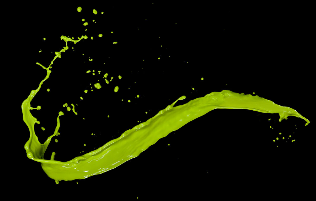 Green paint splash on black background