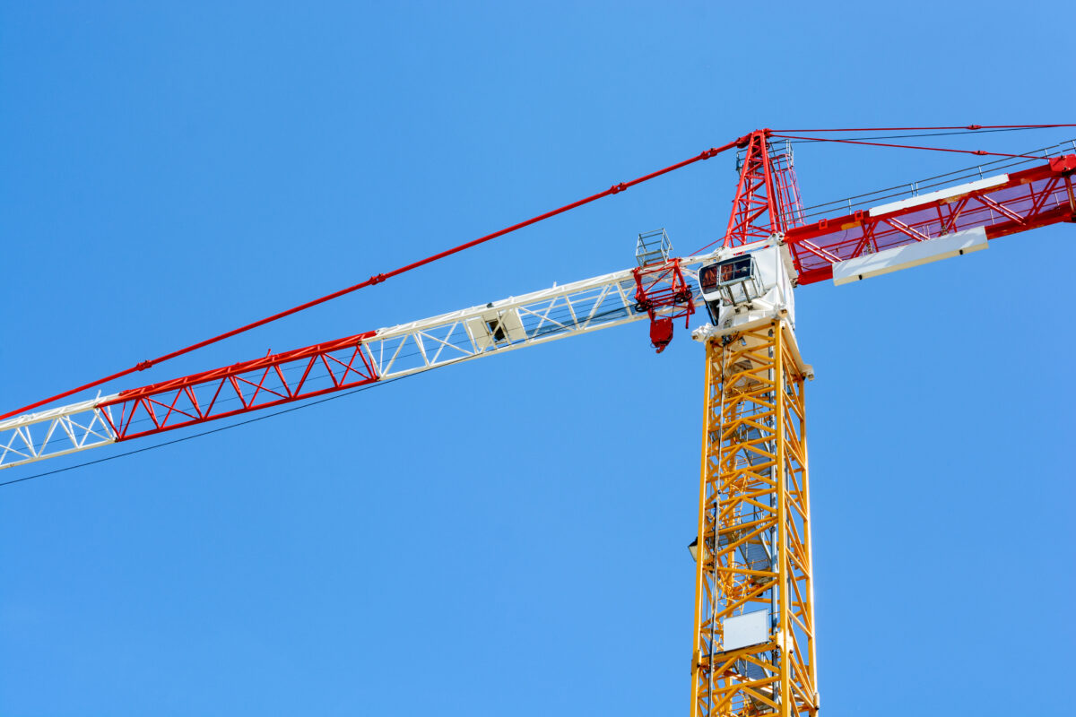 Tower crane against blue sky