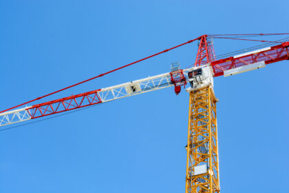 Tower crane against blue sky