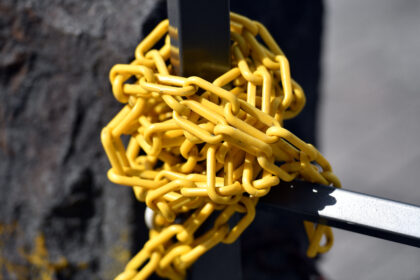 A,Post,That,Has,Been,Wrapped,By,A,Yellow,Plastic