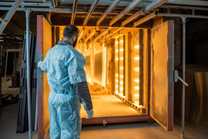 Worker,Of,The,Painting,Shop,Pushing,Metal,Products,Into,The