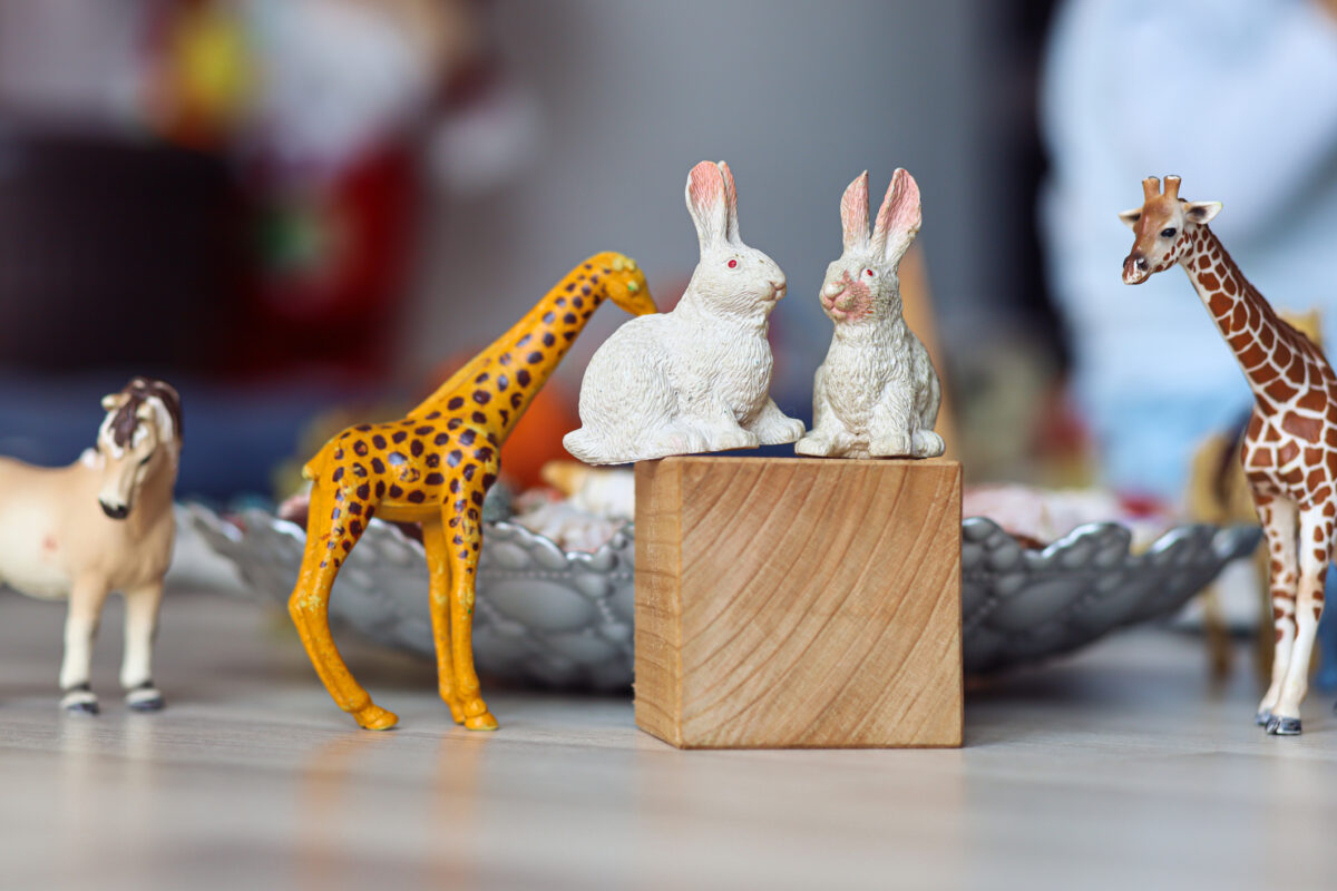 Animal toys – two loving white rabbits looking at each other