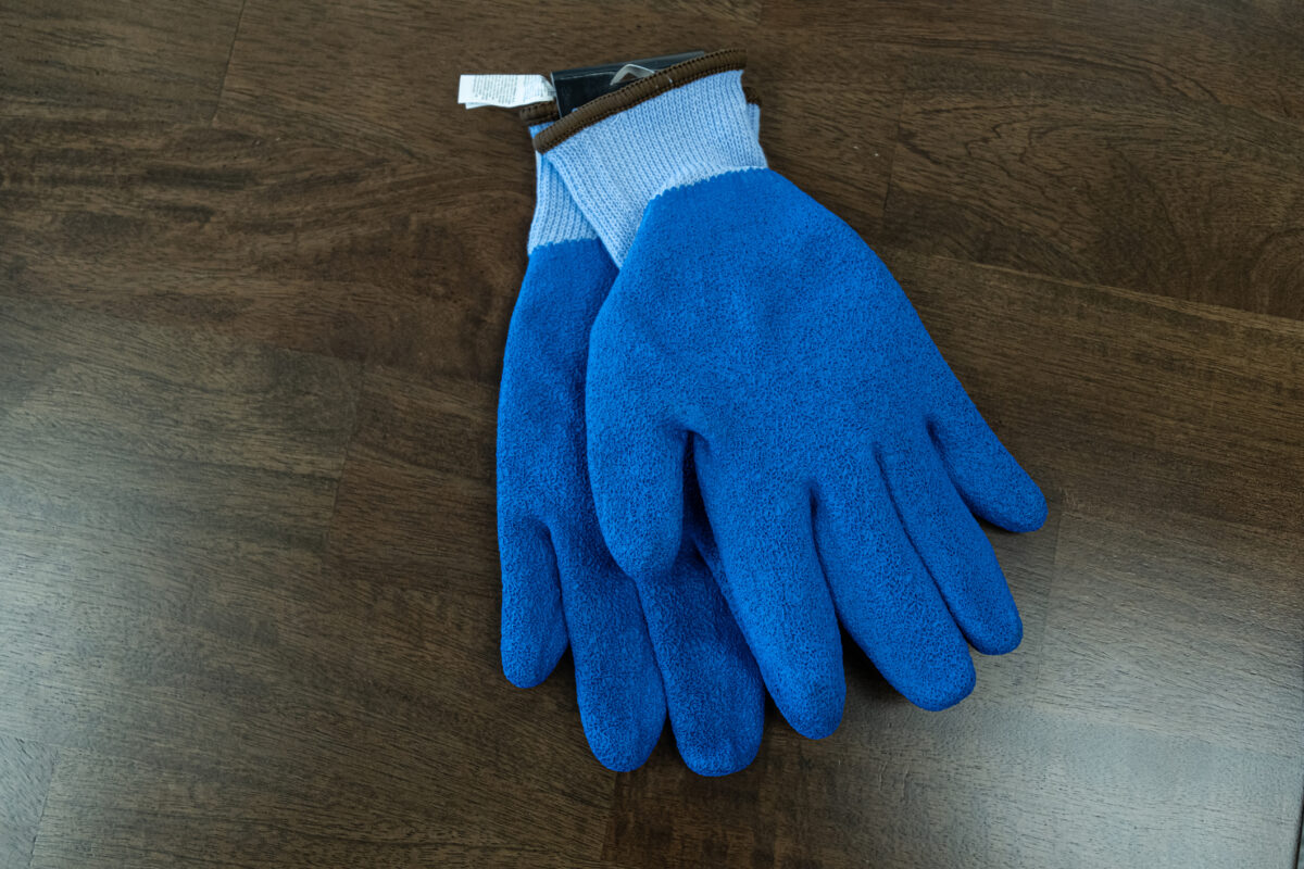 Blue safety protection gloves in factory workshop